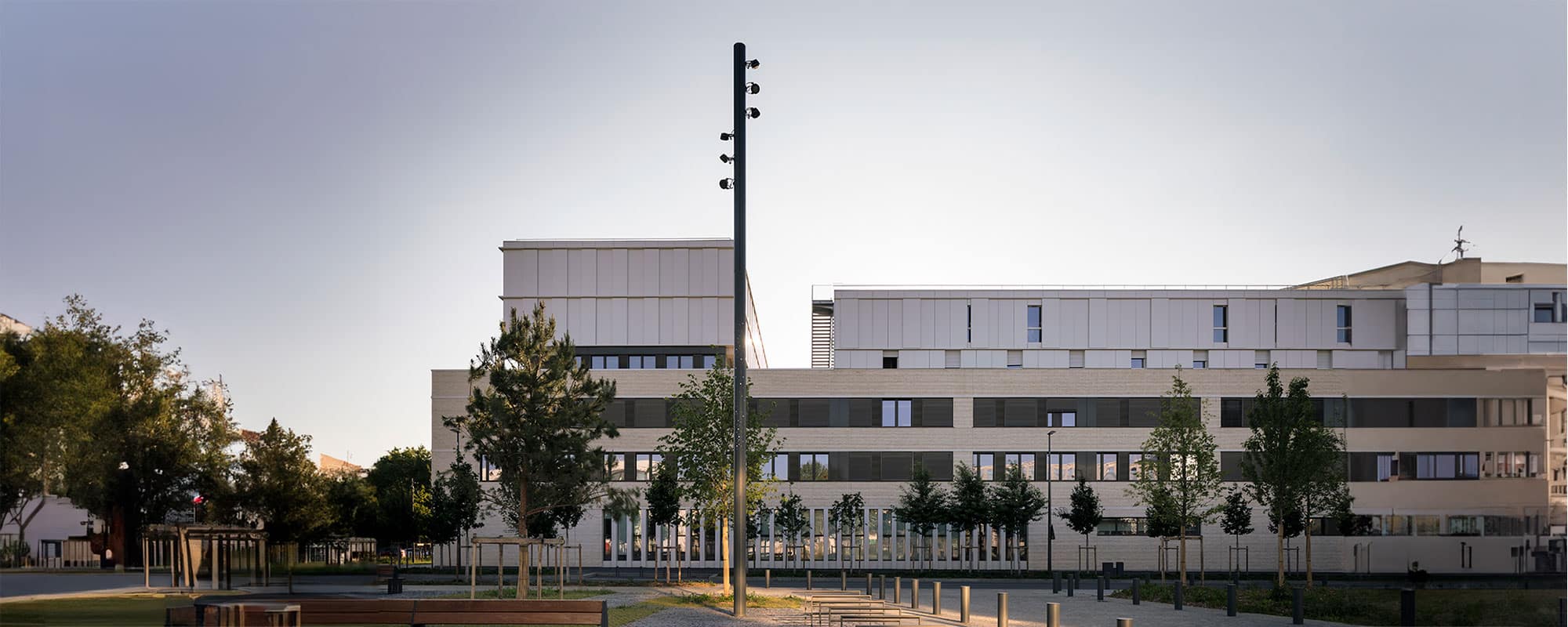 The Green, Saclay, France dotted with custom-made openwork Structure K equipped with our Paulette floodlights